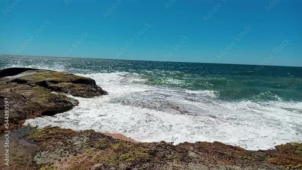Waves crashing on the rocks of Rio das Ostras beach, Costa Azul of Rio de Janeiro, Brazil Waves crashing on the rocks of Rio das Ostras beach, Costa Azul of Rio de Janeiro, Brazil