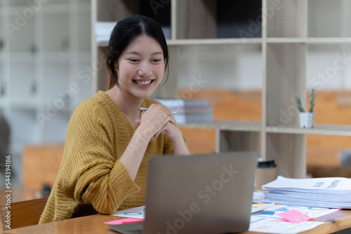 Smart asian business woman smiling at office space. real estate, lawyer, non-profit, marketing, account photo