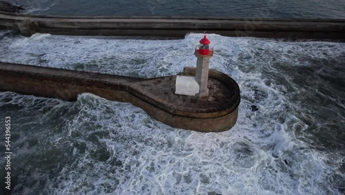 Aerial circle view of the beautiful lighthouse on the coast of the ocean, Twilights 