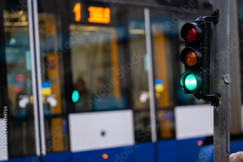 Fotobehang traffic light on the street junction with beautiful bokeh, city with cars in the