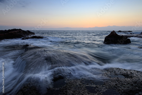 Rocky shore of the Atlantic Ocean at high tide at sunset © Uladzimir