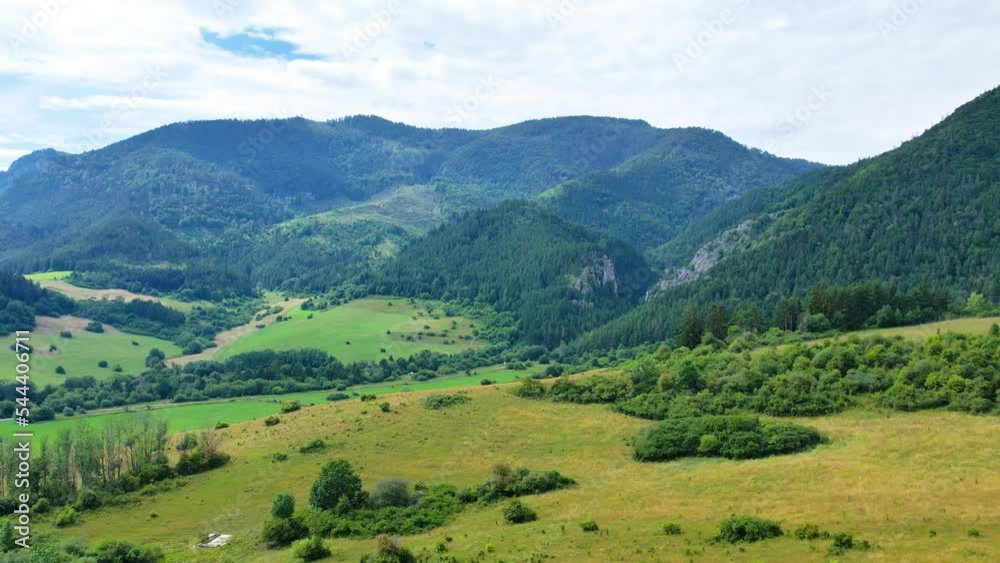 Aerial drone view to mountains, fields, green forest near Liptovska Mara in Slovakia Aerial drone view to mountains, fields, green forest near Liptovska Mara in Slovakia