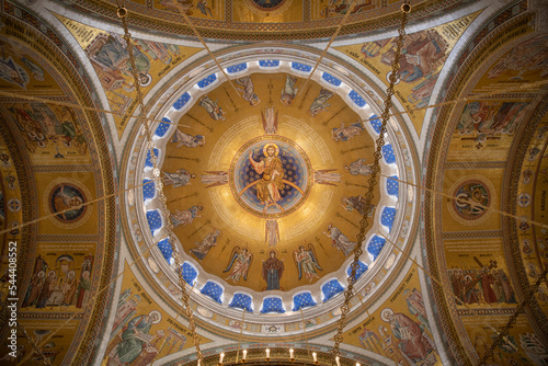 Interiors of St. Sava's Church in Belgrade with religious paintings and mosaics on the luxuriously gold decorated walls. Belgrade, Serbia 22.09.2022