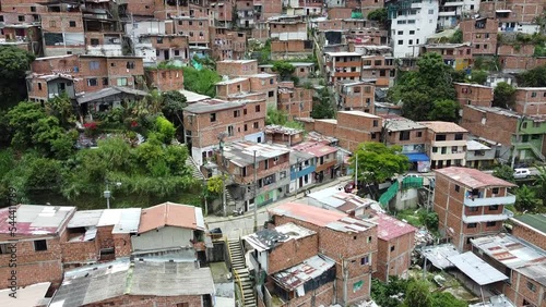 Medellin, Colombia, drone aerial view of Comuna 13 slums poor homes. Once one of the most dangerous neighborhoods in world, Comuna 13 has reinvented itself in recent times and now is considered safe 
