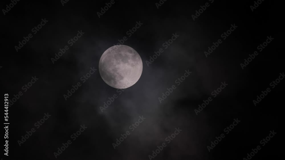 Full moon in clouds in California sky. Full moon in clouds in California sky.