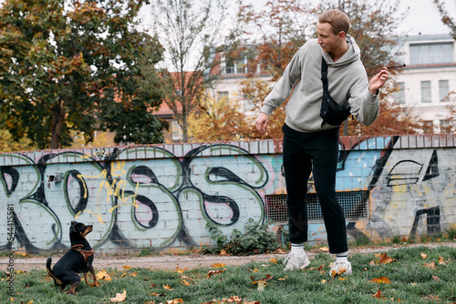 Photography Man playing with his dog