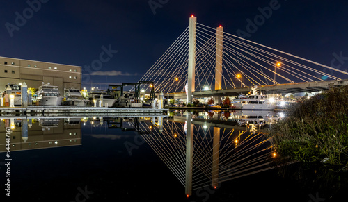 Tacoma, Washington, East 21st Street Bridge reflected in the water at night.