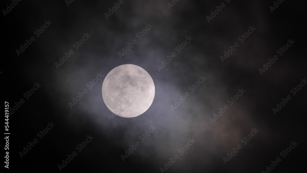 Full moon in clouds in California sky. Full moon in clouds in California sky.