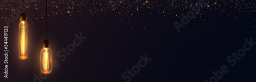 Foto Background with warm light Edison light bulbs and golden glitter.