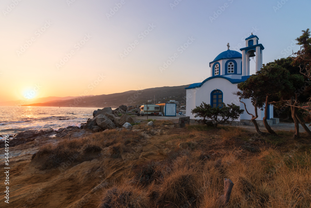 Small  Analipsi Chapel in tarditional blue and white painting  at the cozy fishing village of Gialiskari, on the grrek island of karia.