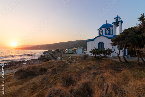 Small  Analipsi Chapel in tarditional blue and white painting  at the cozy fishing village of Gialiskari, on the grrek island of karia. photo