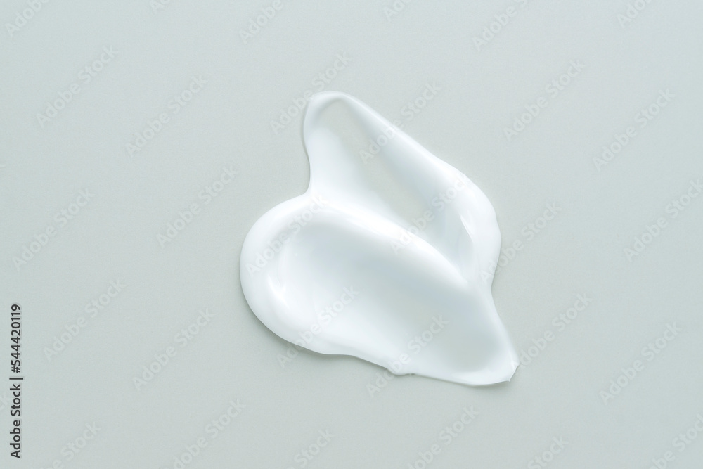White cosmetic cream texture, skincare lotion swatch on neutral background. Face creme, body moisturiser, hair conditioner smear smudge stroke. Creamy beauty product closeup White cosmetic cream texture, skincare lotion swatch on neutral background. Face creme, body moisturiser, hair conditioner smear smudge stroke. Creamy beauty product closeup