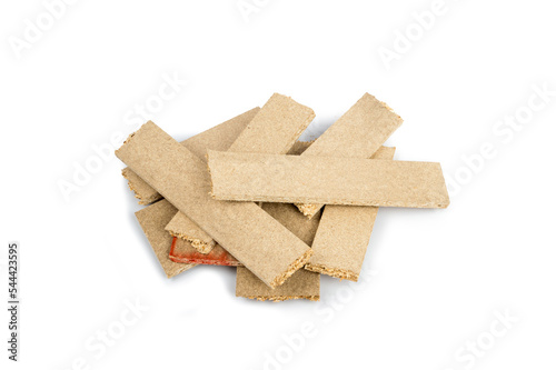 a pile of broken untreated mdf slabs of brown color on a white background close-up