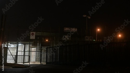 The fence of the city of Melilla, Spain, in the dark night borders Morocco, Africa.