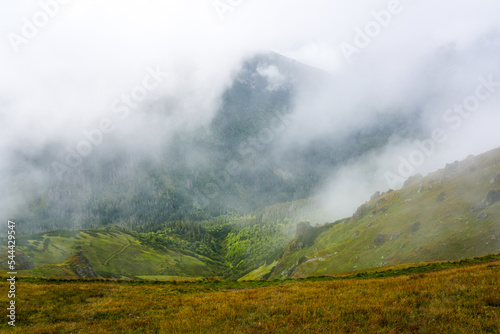 A foggy morning in the valley of the Tatra Mountains in Poland