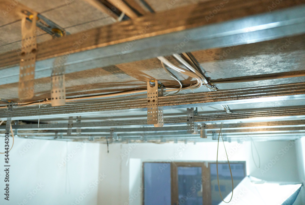 Close up view of the metal structure of the ceiling under plasterboard