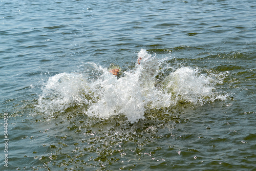 Splash made by man jumped in the water