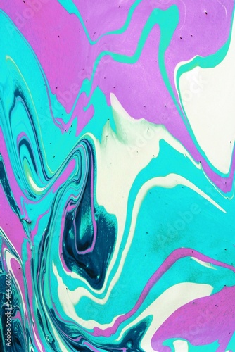 Abstract background of pink and blue marble. Acrylic paint spreads freely and creates an interesting pattern. Background for the cover of a laptop, notebook.