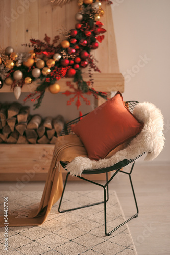 Сozy armchair by the Christmas fireplace