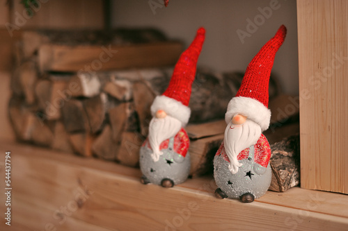 Сhristmas gnomes by the fireplace