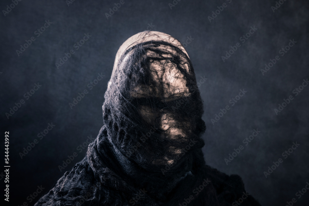 Fotografie Creepy figure on dark misty background