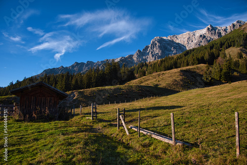 hochkönig Pinzgau Salzburg im Herbst abendlicht goldene stunde mit blau Himmel und wolken, hochkonig Mountain in golden hour under Blue sky with Clouds in Austrian alps autumn fall Indian summer photo