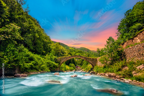 Daytime long exposure with neutral density filter of Firtina Creek and Historical Ottoman Stone Bridge. Kaçkar Mountains National Park, Rize, Turkey