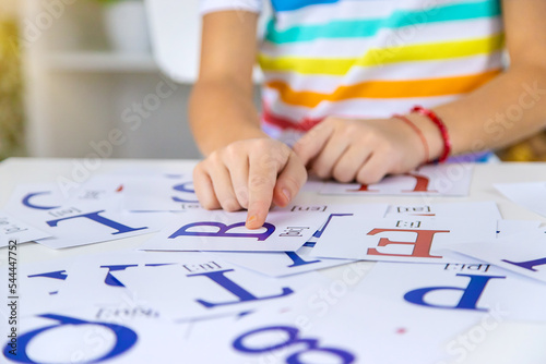 Cuadro en lienzo The child learns English letters. Selective focus.