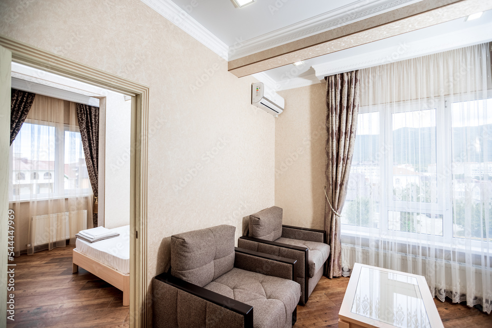 Apartments for rent. Corner sofa and two armchairs in front of the TV Apartments for rent. Corner sofa and two armchairs in front of the TV