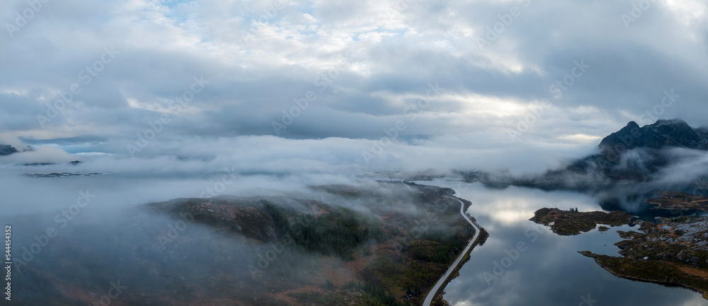Aerial panoramic view above Norway mountains with lake.
