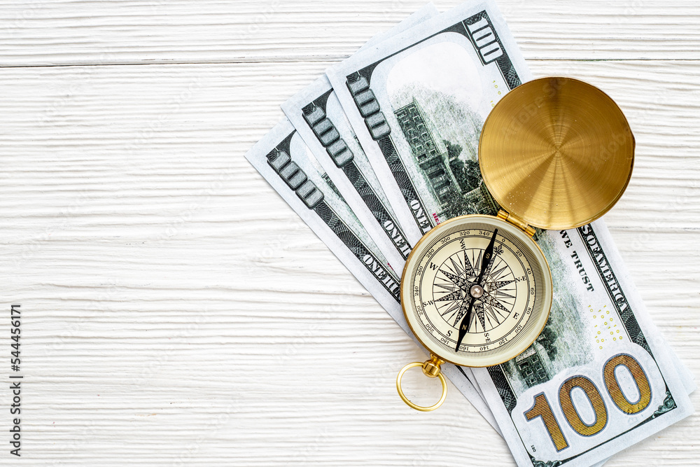 Compass and money cash - exchange rate change concept