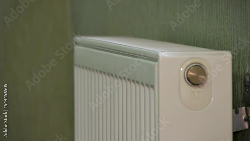 Wallpaper Mural global problem of energy supply
entering the winter period
cold batteries
male hand checks battery temperature
a man puts his hand on a white new battery to check the presence of heating Torontodigital.ca