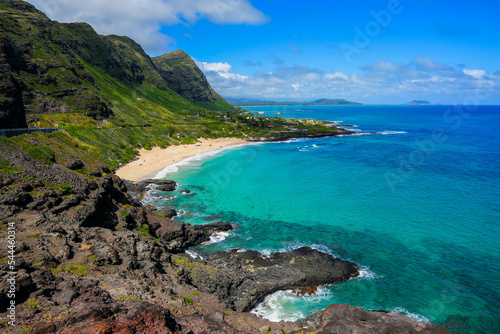 Green mountains over Makapu u Beach Park with the translucent waters of the Pacific Ocean on the eastern side of Oahu island in Hawaii  United States
