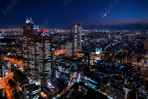 Photography Skyscrapers towering above the night cityscape of Nishi-Shinjuku, Tokyo, Japan