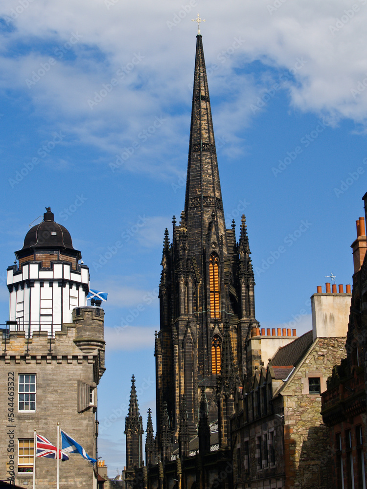 Gothic architecture of Tolbooth Church beside Camera Obscura dome in Edinburgh Scotland