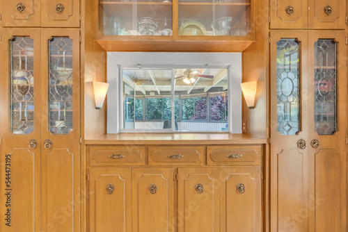 Dining room with wood cabinets