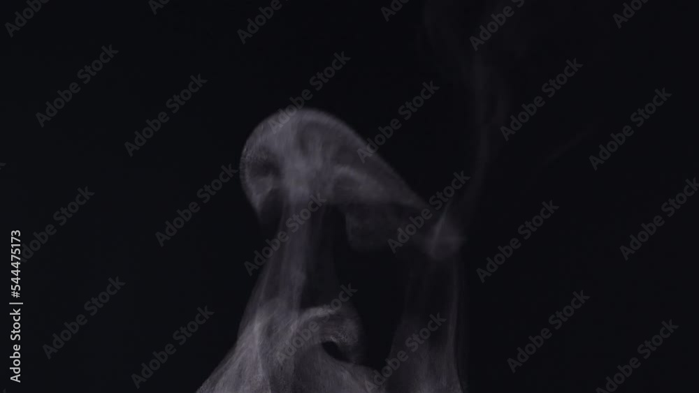 White steam smoke vapor coming up from a hot coffee cup in extreme close-up, authentic nature steam smoke, mist on a black background, shot in 4K. Concept of steam, smoke, vapor, mist, fog White steam smoke vapor coming up from a hot coffee cup in extreme close-up, authentic nature steam smoke, mist on a black background, shot in 4K. Concept of steam, smoke, vapor, mist, fog