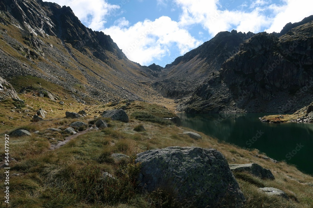 Fototapeta premium Pyrenees, Carros de Foc hiking tour. A week long hike from hut to hut on a natural scenery with lakes, mountains and amazing flora and fauna. 