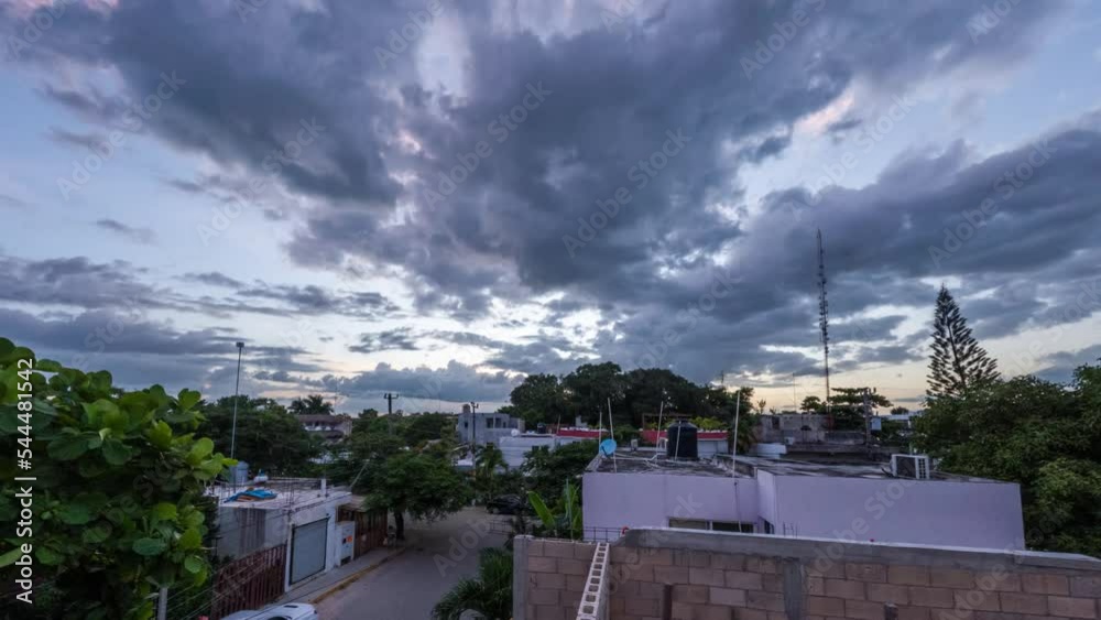 Beautiful sunset over Tulum, Mexico. View from the roof of the house to the city at sunset. Beautiful sunset over Tulum, Mexico. View from the roof of the house to the city at sunset.