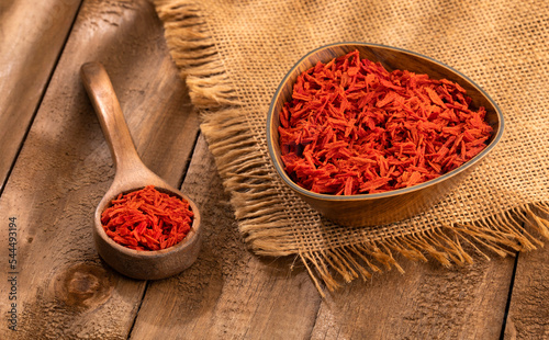 Solanum lycopersicum - Dehydrated dried tomato flakes in the bowl photo