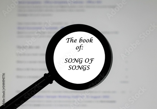 The Book of Song of Songs from the Holy Bible, illustrated inside a magnifying class, zoomed in. 