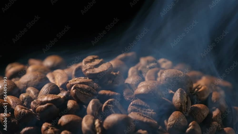 Slow motion of roasted coffee beans falling. Organic coffee seeds. Slow motion of roasted coffee beans falling. Organic coffee seeds.