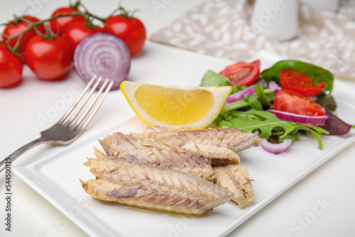 Delicious canned mackerel fillets served on white table
