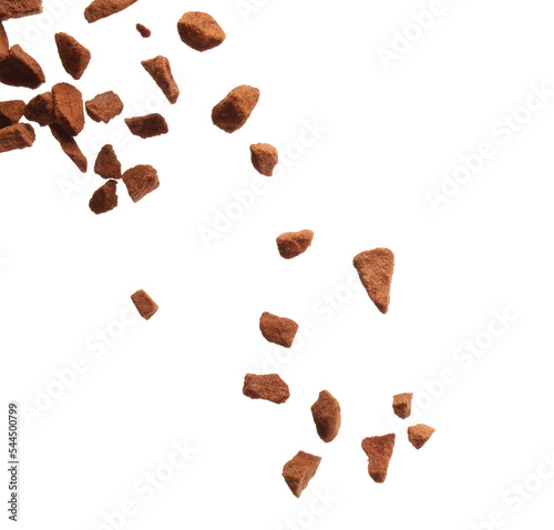 Pouring aromatic instant coffee on white background