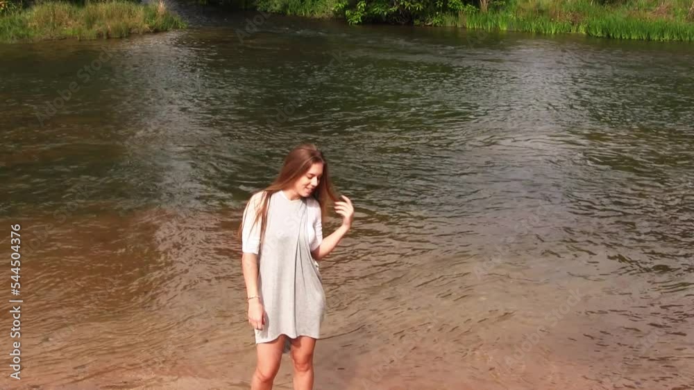 Caucasian Teen Woman Walking In Front Of River Gray Dress Standing And Then Leaving Frame
Caucasian Teen Woman Walking In Front Of River Gray Dress Standing And Then Leaving Frame