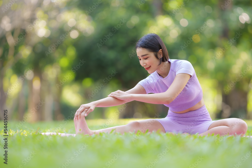 Yoga in the park Beautiful Asian woman practicing yoga poses in the park with beautiful and balanced postures. Yoga in the park Beautiful Asian woman practicing yoga poses in the park with beautiful and balanced postures.