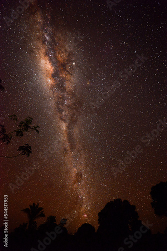 The Milky Way above the Guaporé-Itenez river and the rainforest surrounding the small, remote Amazonian village of Cafetal, Beni Department, Bolivia, on the border with Rondonia state, Brazil