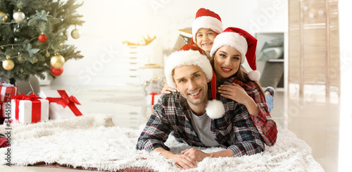Happy family in Santa hats ...