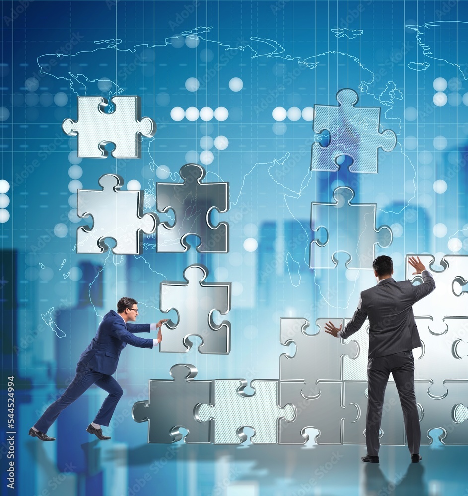 Business concept of teamwork with puzzle pieces Business concept of teamwork with puzzle pieces