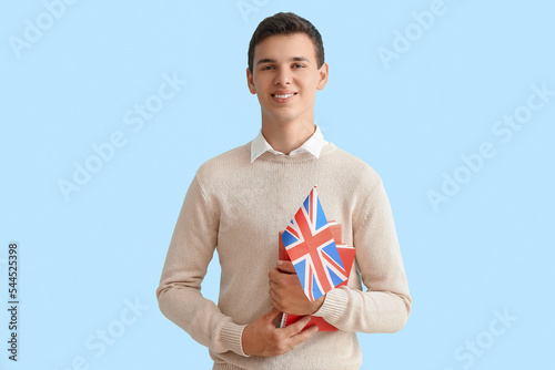 Teenage boy with UK flag on...